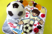 サッカーボールとアニメのイラストケーキ