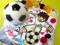 サッカーボールとアニメのイラストケーキ